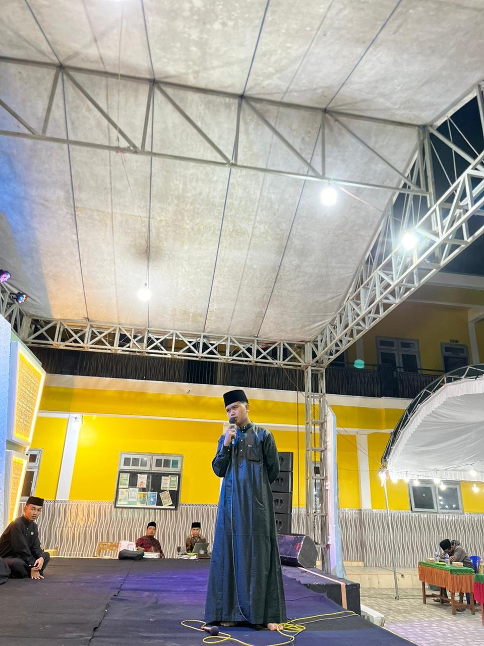 PELAKSANAAN I'LAN NADZHOM ALFIYA' IBNU MALIK DAN WISUDA ILMU A'RUDL OLEH SISWA MA MAMBAUL ULUM 2 PONJANAN TIMUR